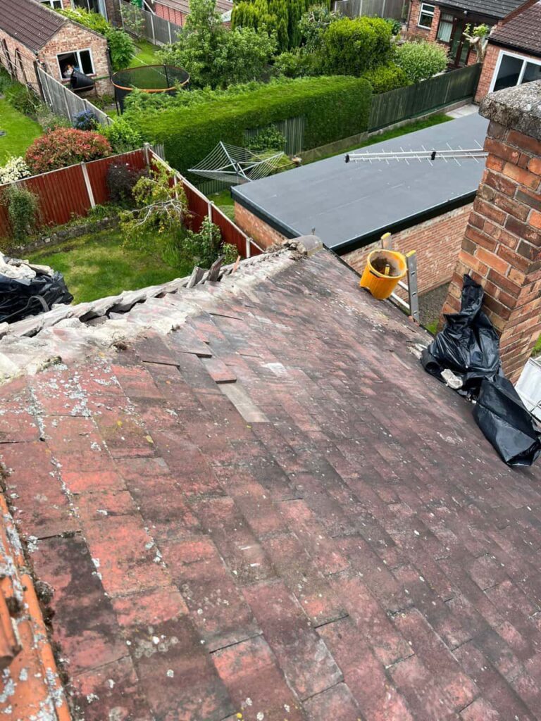 This is a photo of a roof where the hip tiles have been removed, and are just about to be replaced. Works carried out by Giltbrook Roofing Repairs