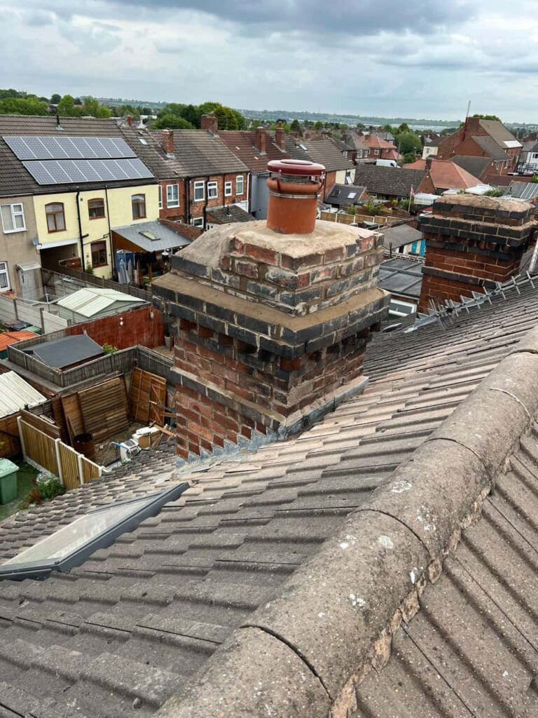 This is a photo taken from a roof which is being repaired by Giltbrook Roofing Repairs, it shows a street of houses, and their roofs